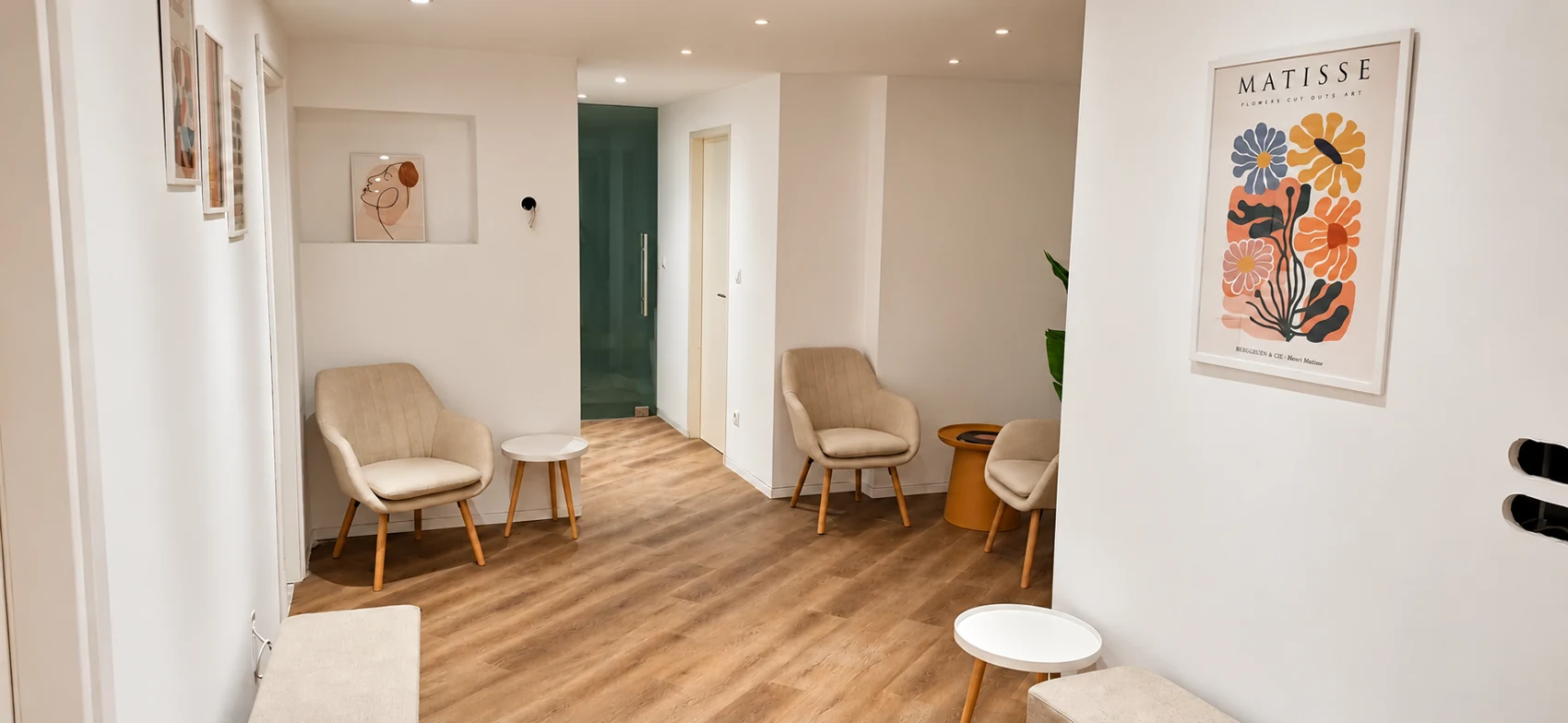 The welcoming Figleaf Kypseli lobby with cream chairs and local artwork
